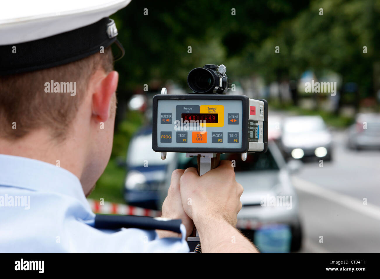 Traffic, speed control by police in a city, with a laser speed meter