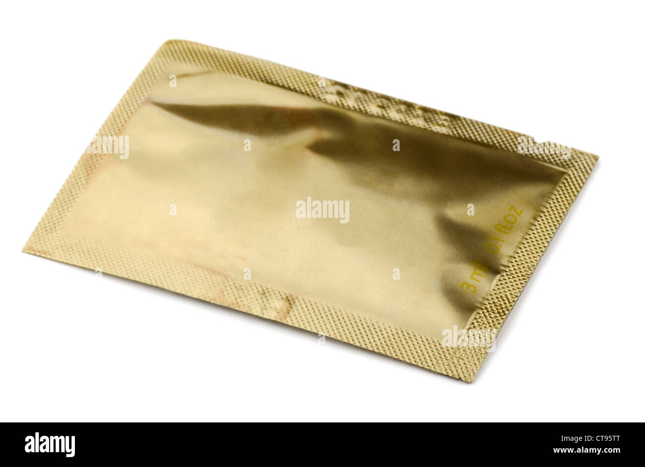Golden small cosmetics sachet isolated on white Stock Photo