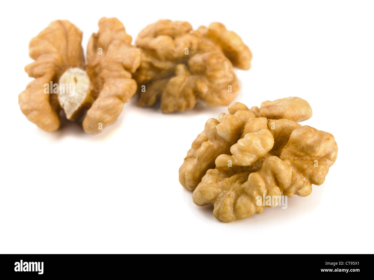 Group of peeled walnuts isolated on a white Stock Photo