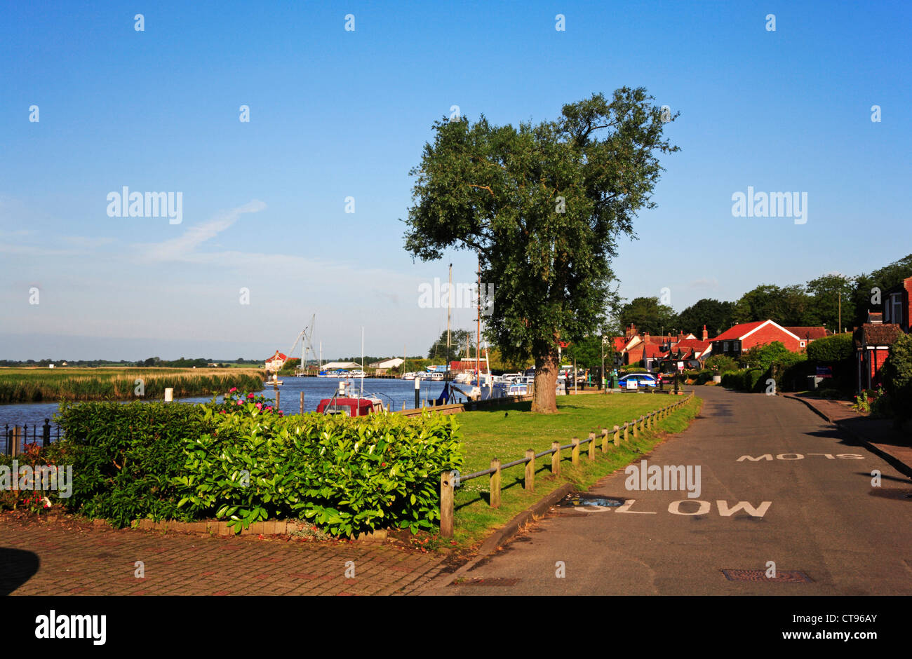 A view of the river frontage and boat moorings by the River Yare on the