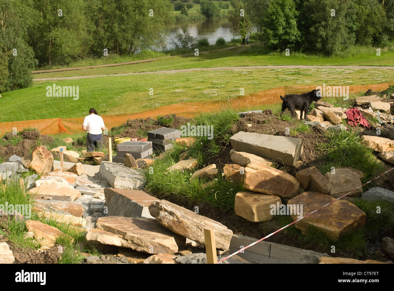 Landscape gardeners at work with dog Stock Photo