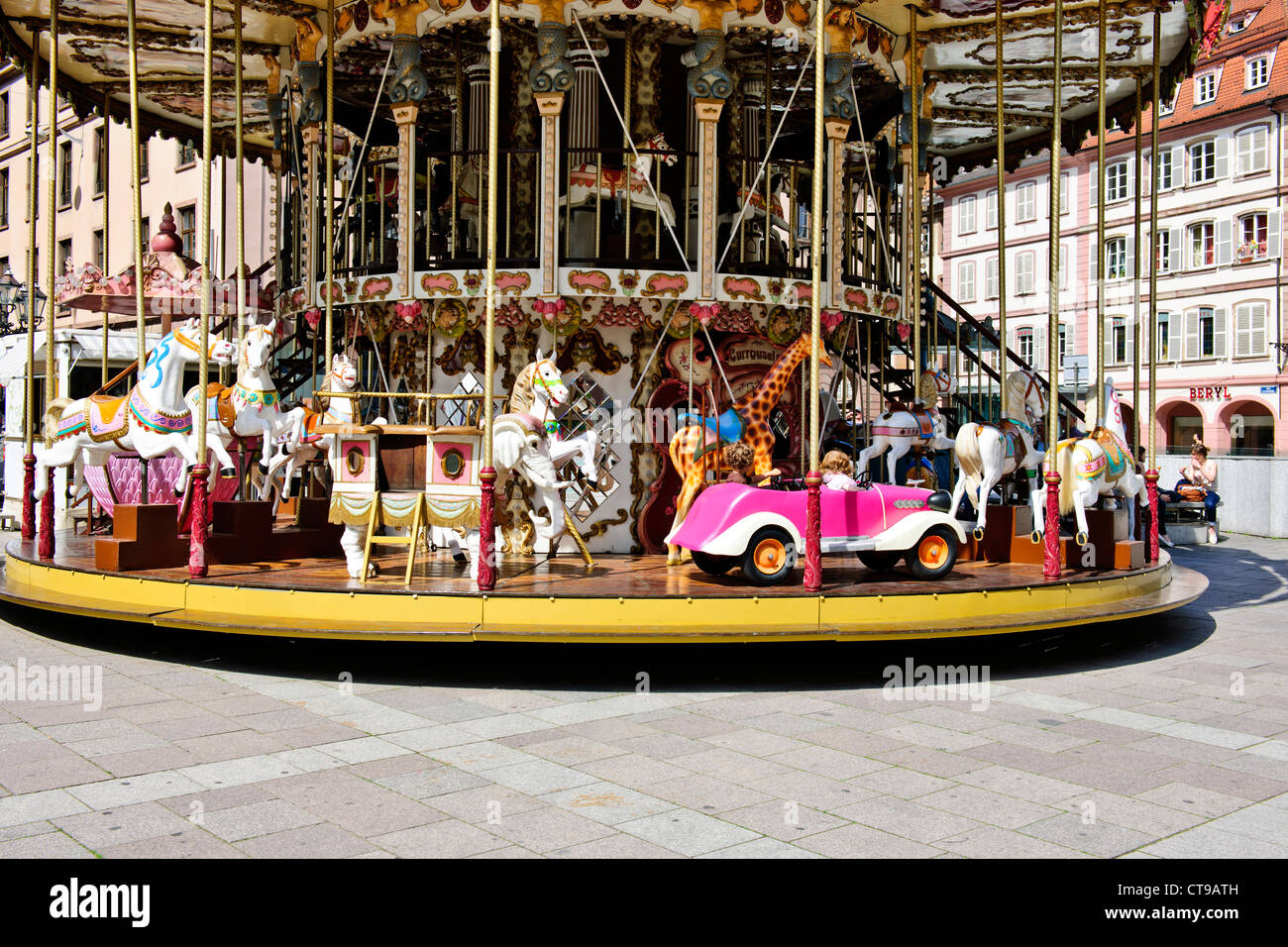 A carousel (from French carrousel, from Italian carosello),or merry-go-round,Place Gutenberg,Strasbourg,France Stock Photo