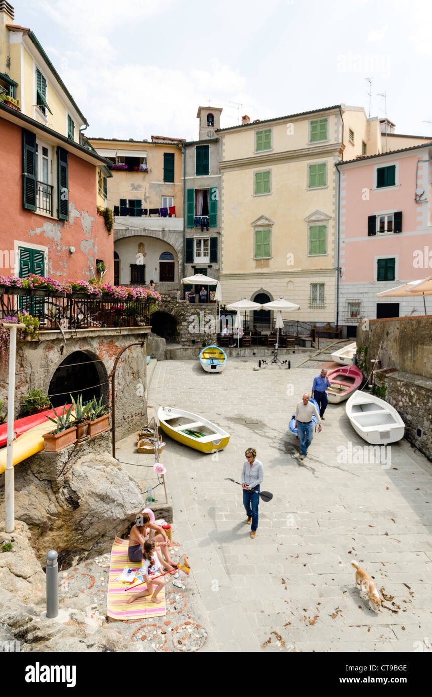 Locals on town beach Lerici Tuscany Italy Stock Photo