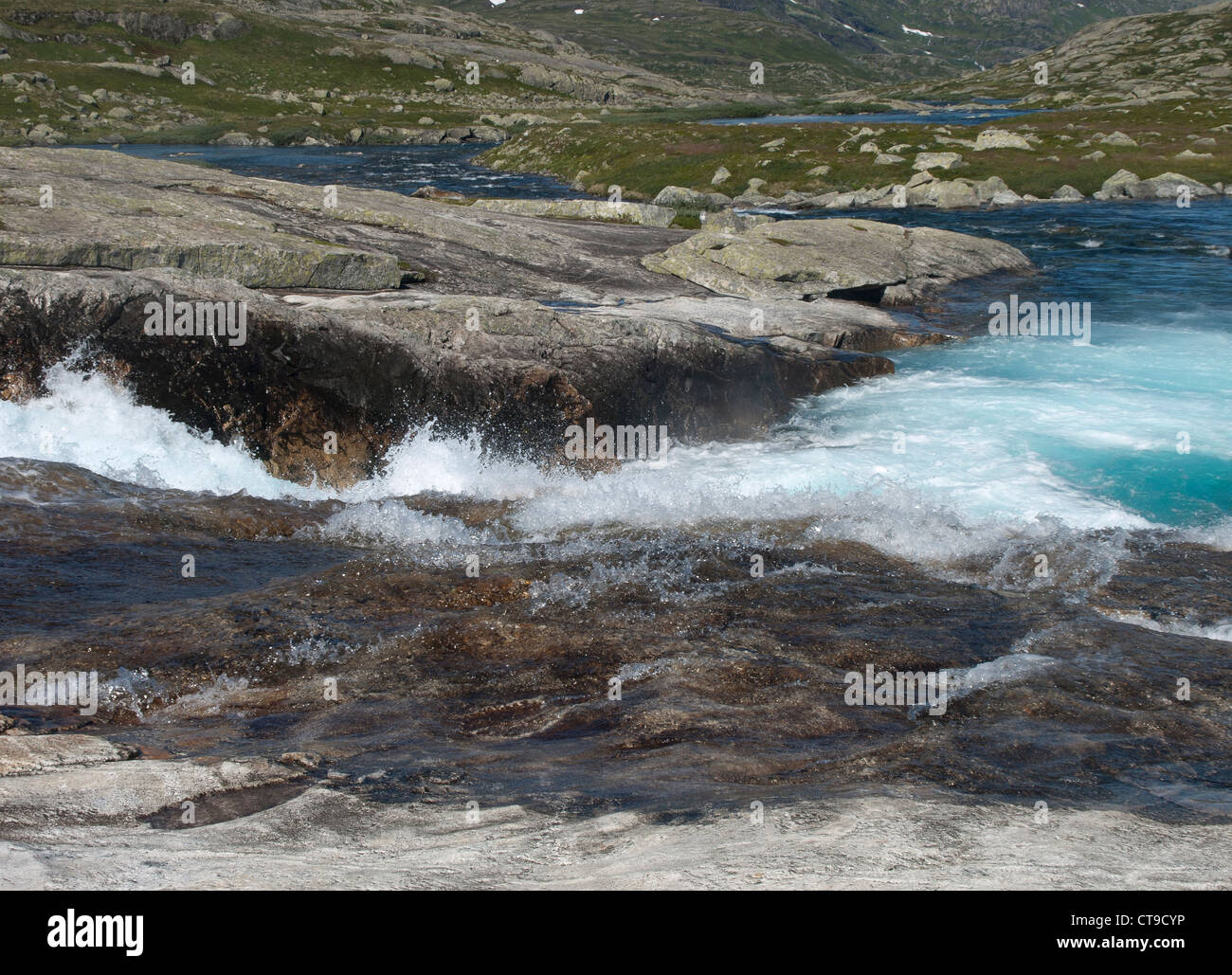 Rushing mountain river rapids with clear water in Norway Stock Photo