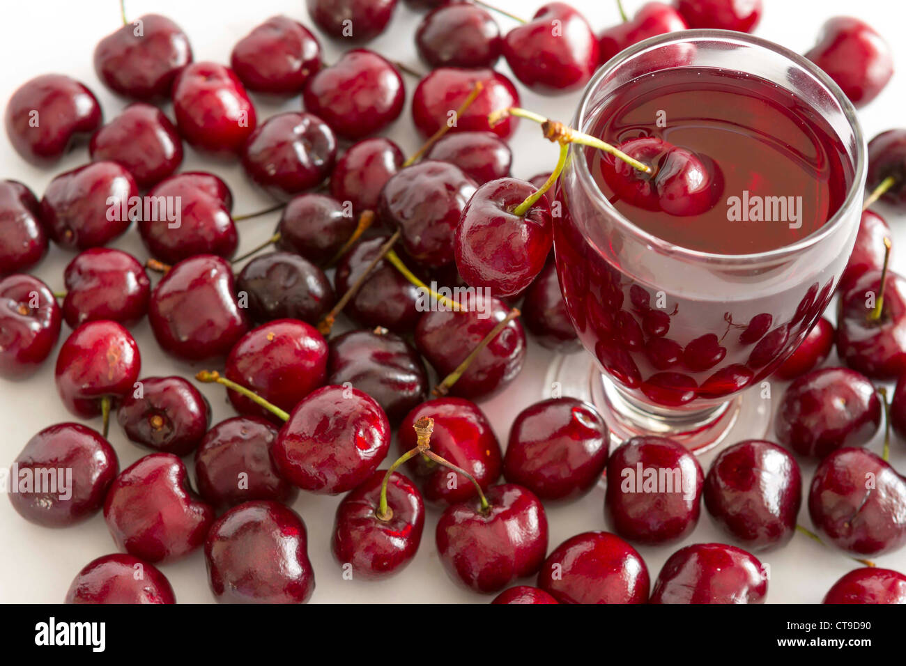 Fresh cold drink with cherry against white background Stock Photo