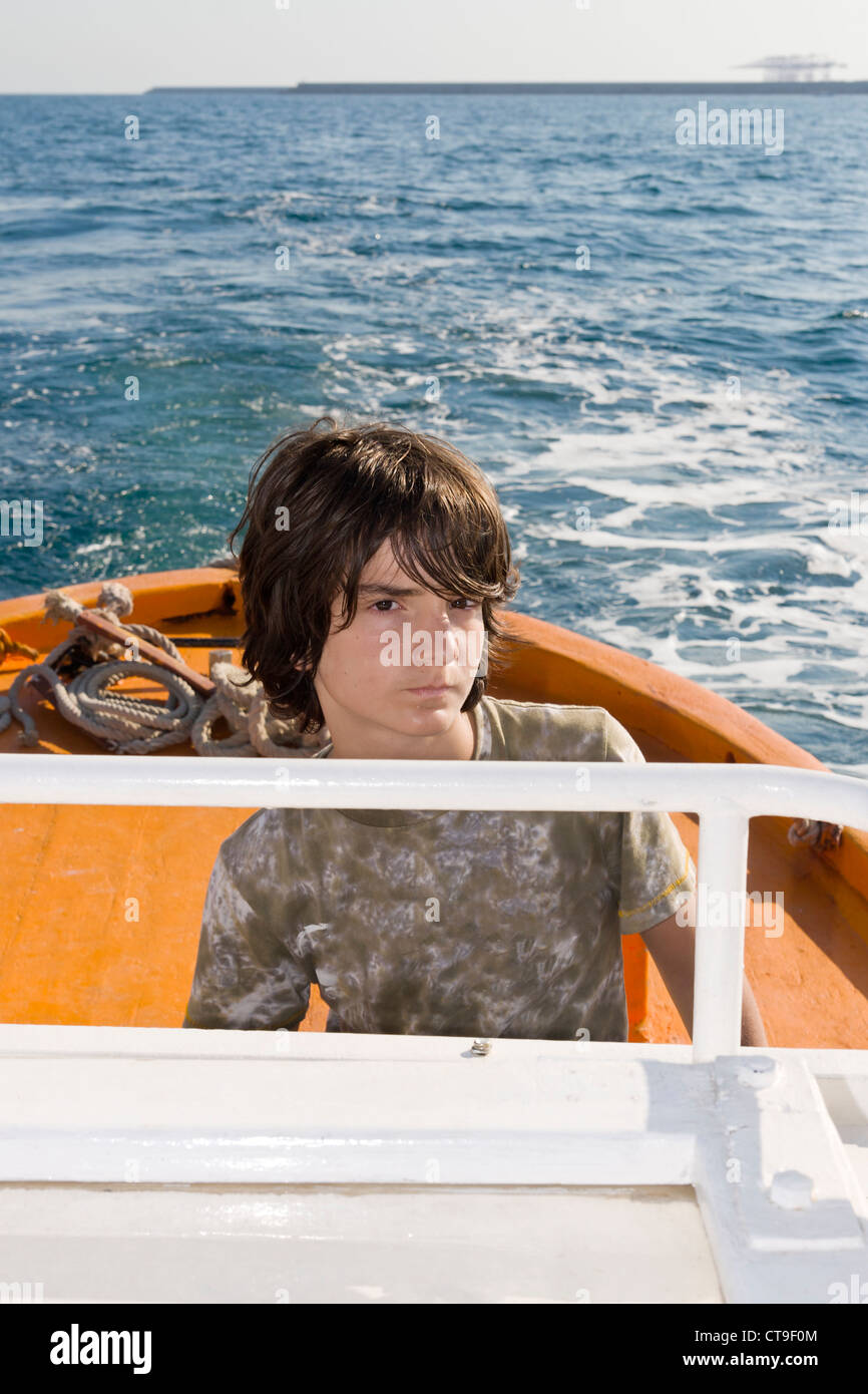 Boy driving boat hires stock photography and images Alamy