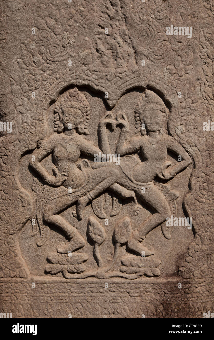 Stone Khmer wall carvings of dancers on sandstone, Angkor Wat, Cambodia Stock Photo