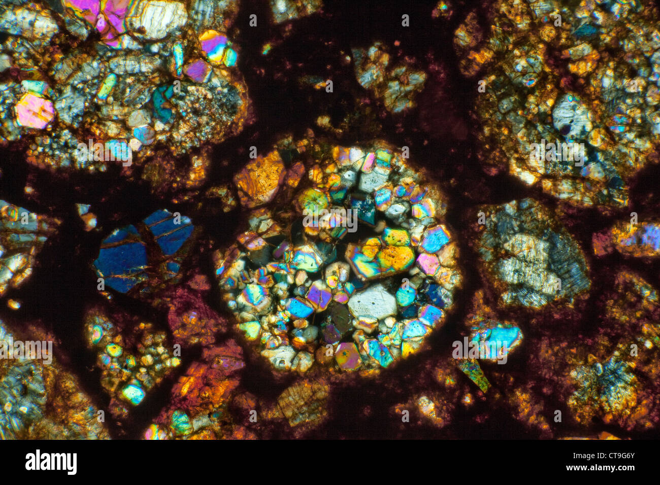 Mereorite thin section photomicrograph, cross polarized lighting, NWA 6326, DLL3-6 (S1/W2) North West African Stock Photo