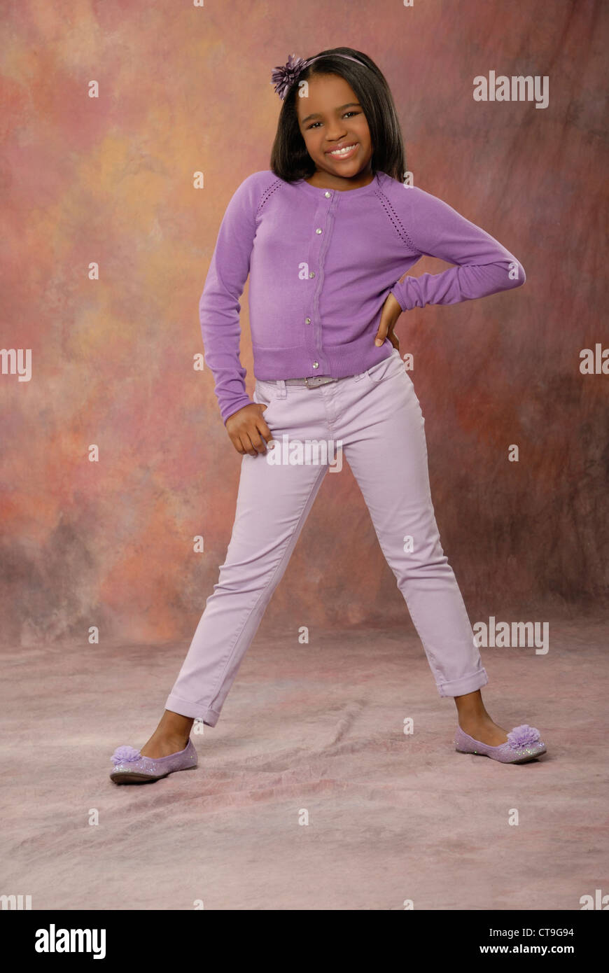 Cute ten year old African American wearing a casual purple outfit Stock  Photo - Alamy