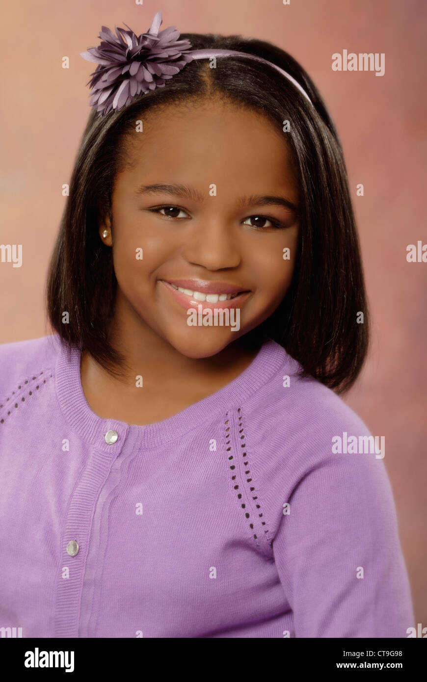 Portrait of a pretty, smiling ten year old girl, African-American ethnicity. Stock Photo