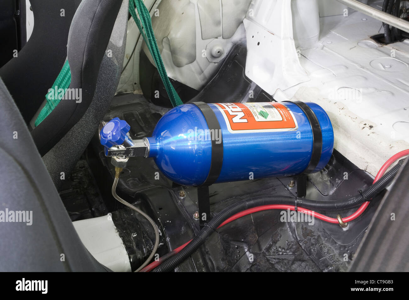 Nitrous oxide funny or laughing gas used to produce extra horsepower in a boy racer style modified custom race car. Stock Photo
