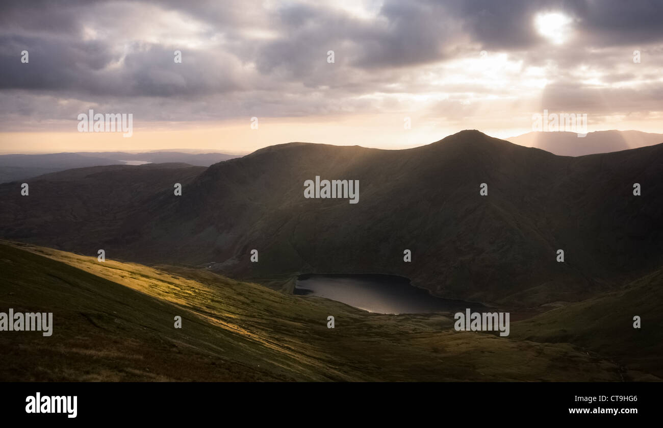 The sun sets over the Lake District Mountains, England UK. Stock Photo