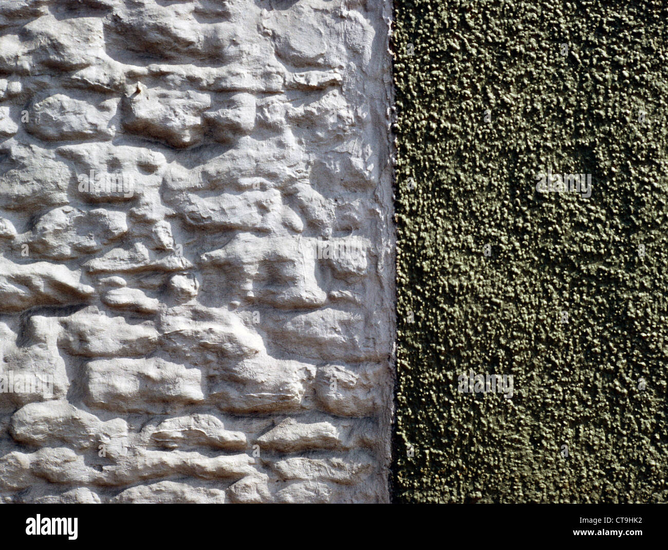 Whitewashed stone and pebble dash covered wall, Wiltshire, UK. Stock Photo