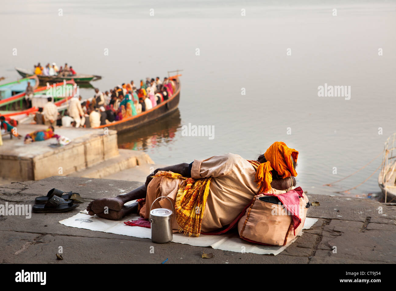 Sadhu lie down at Ghat of Varanasi, Uttar Pradesh, India Stock Photo