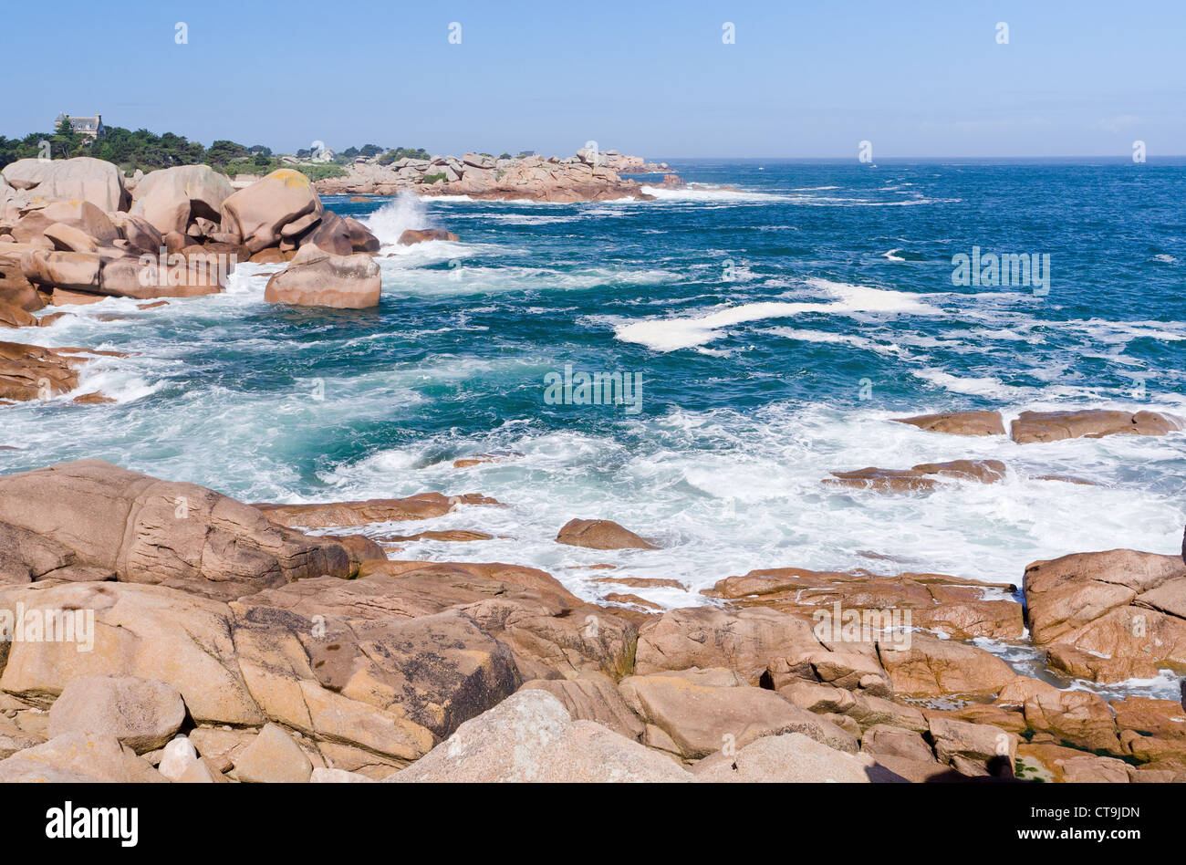sea wave breaks against rocks on Pink Granite Coast in Breton France ...