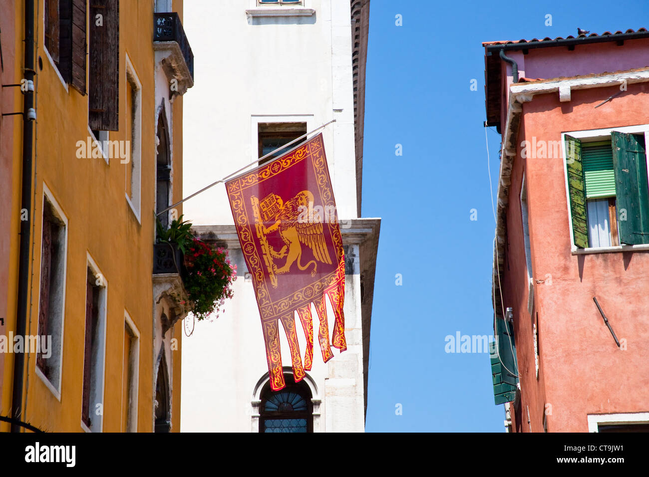 Flag of the Most Serene Republic of Venice on urban house in Venice, Italy Stock Photo