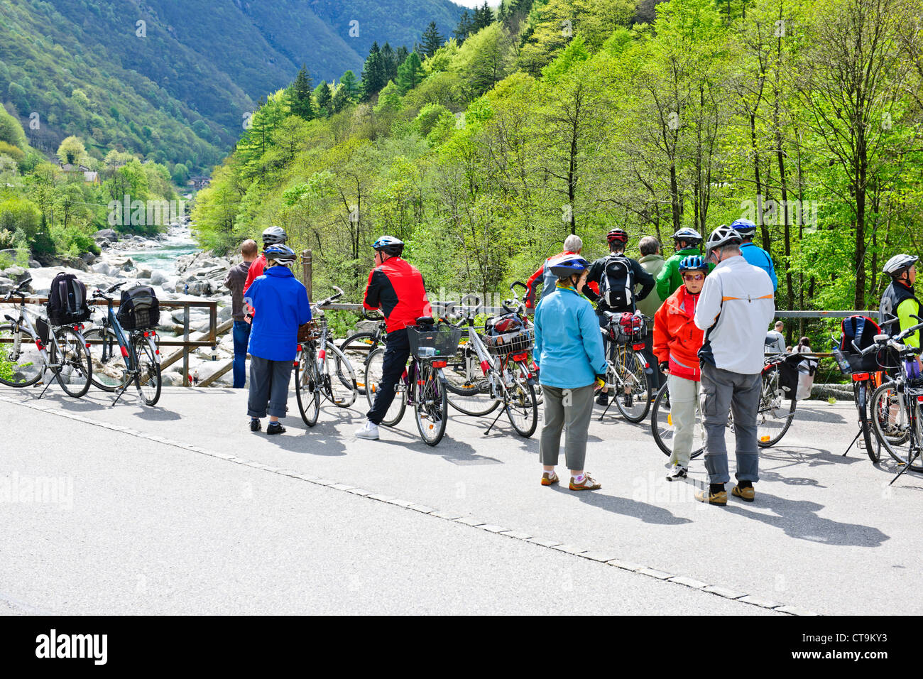 Cycling,Cyclists,Mountain Bike Riding,Crystal Clear Melt Water,Lavertezzo, Bridges,Rocks,Verzasca Valley,Ticino,Switzerland Stock Photo