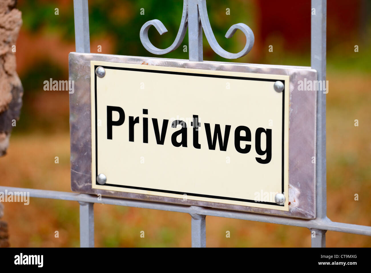 A plate with ' Privatweg' (privat way) on garden door, small city Saarburg, Rheinland-Pfalz, Germany Stock Photo
