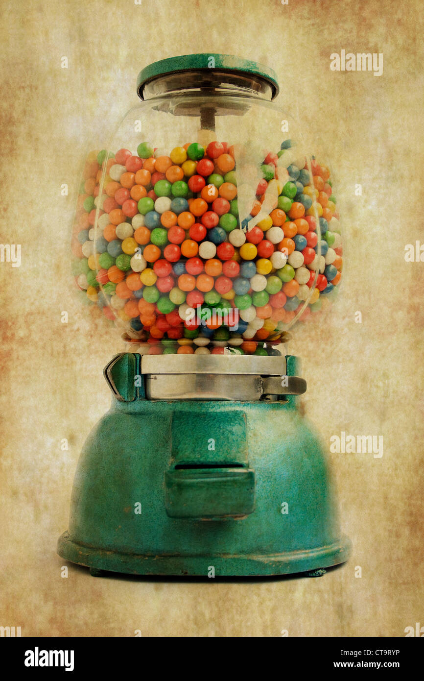Old chewing gum vending machine about 1950 on grunge Stock Photo
