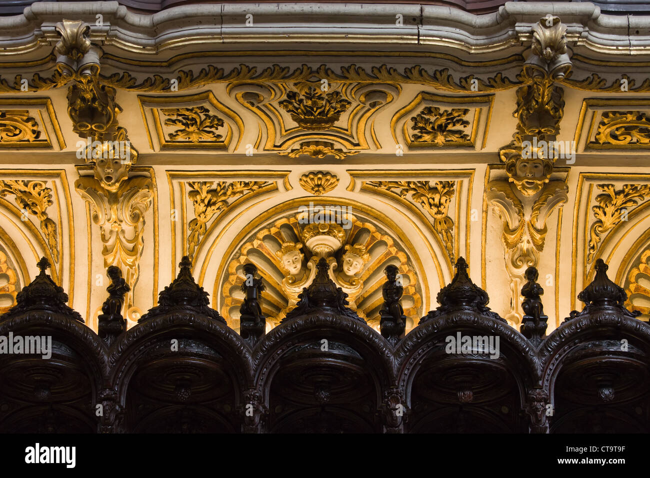 Close-up on the illuminated historic Mezquita Cathedral choir stalls details in Cordoba, Spain. Stock Photo