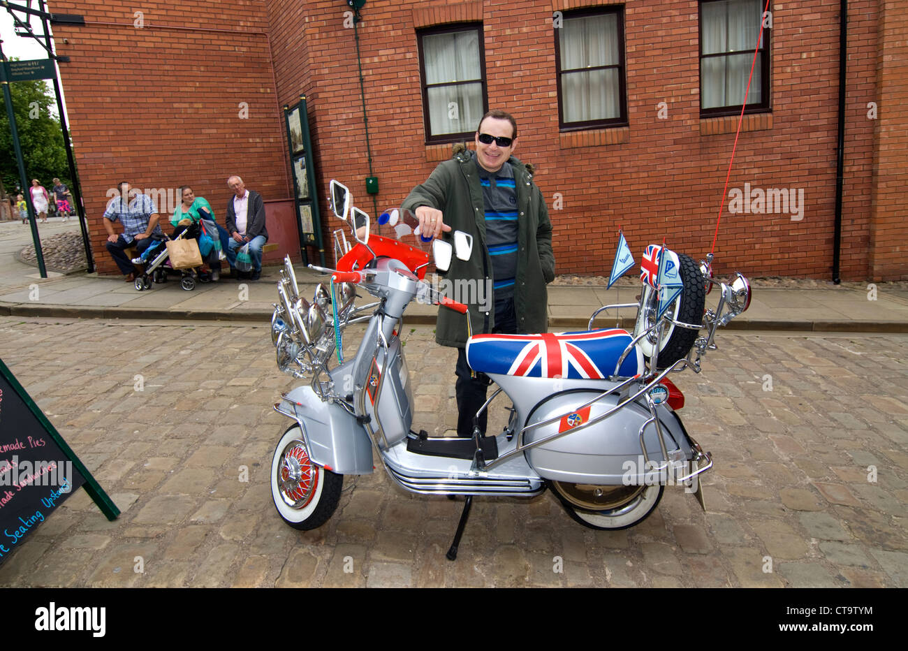 Mod by his Vespa scooter Stock Photo
