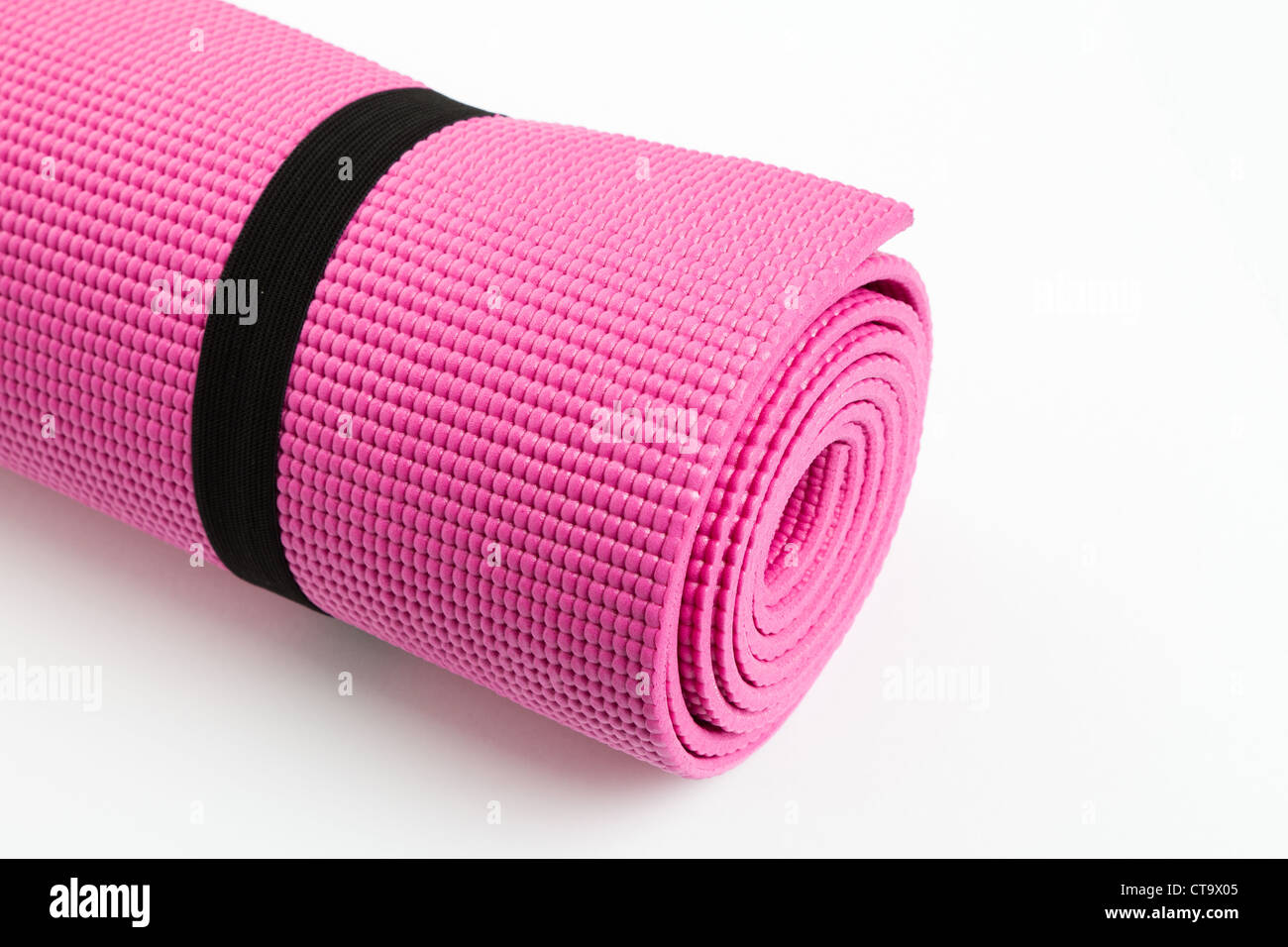 Pink Yoga Mat with White Background Stock Photo