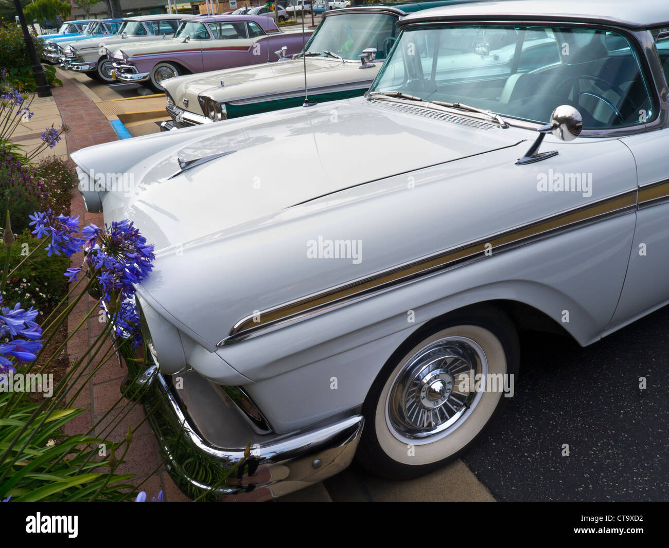 CLASSIC AMERICAN CARS STREET PARKED Line of 1950's Ford Fairlane Skyliner American classic motor cars parked at Carmel California USA Stock Photo