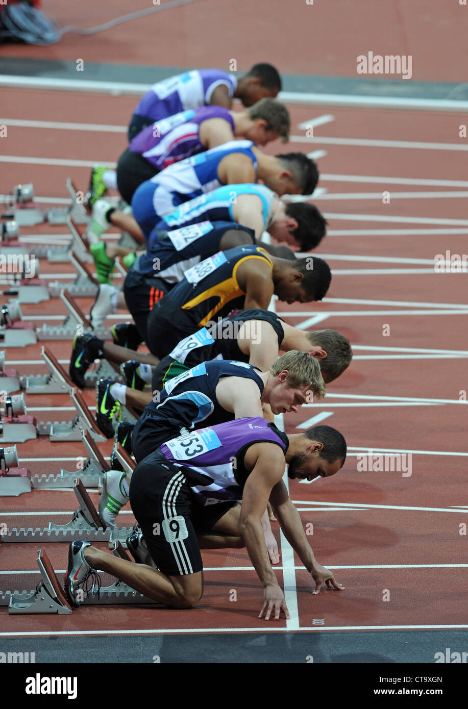 Sprinters in the starting blocks on a running track Stock Photo Alamy