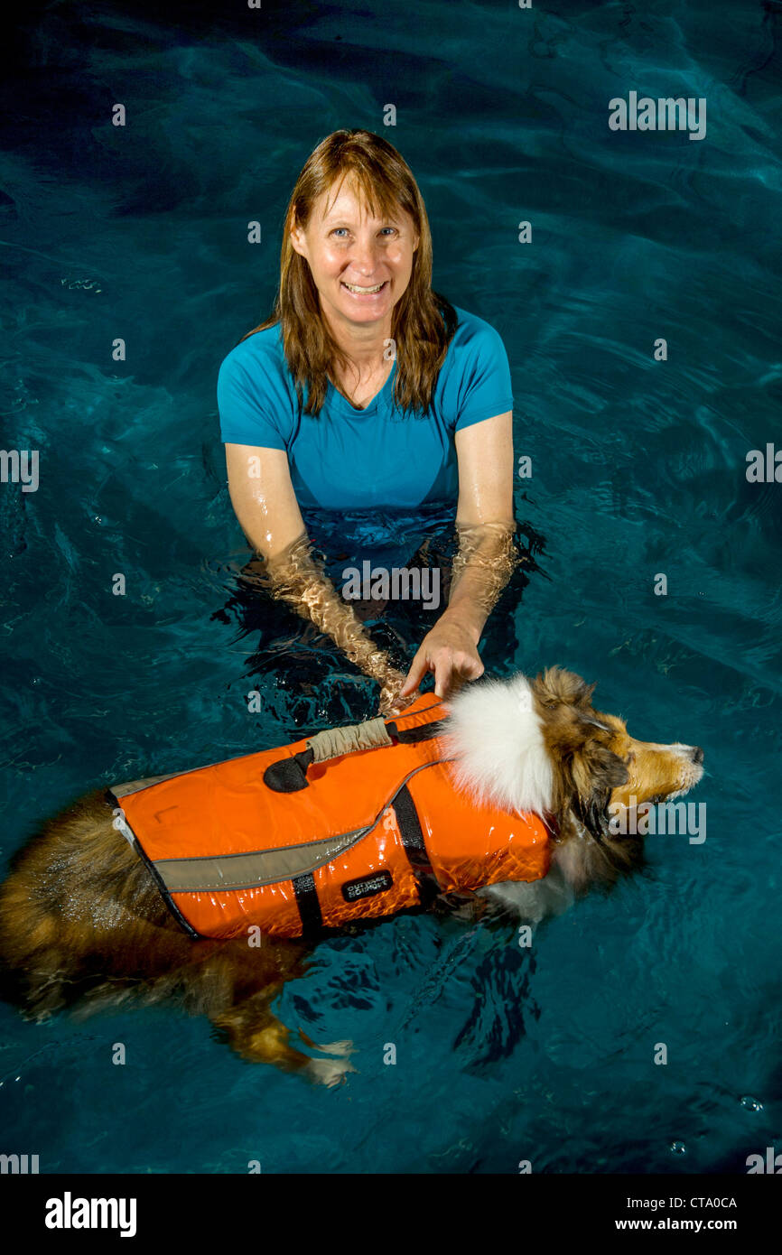 A registered veterinary technician in Oceanside, CA, exercises a dog in
