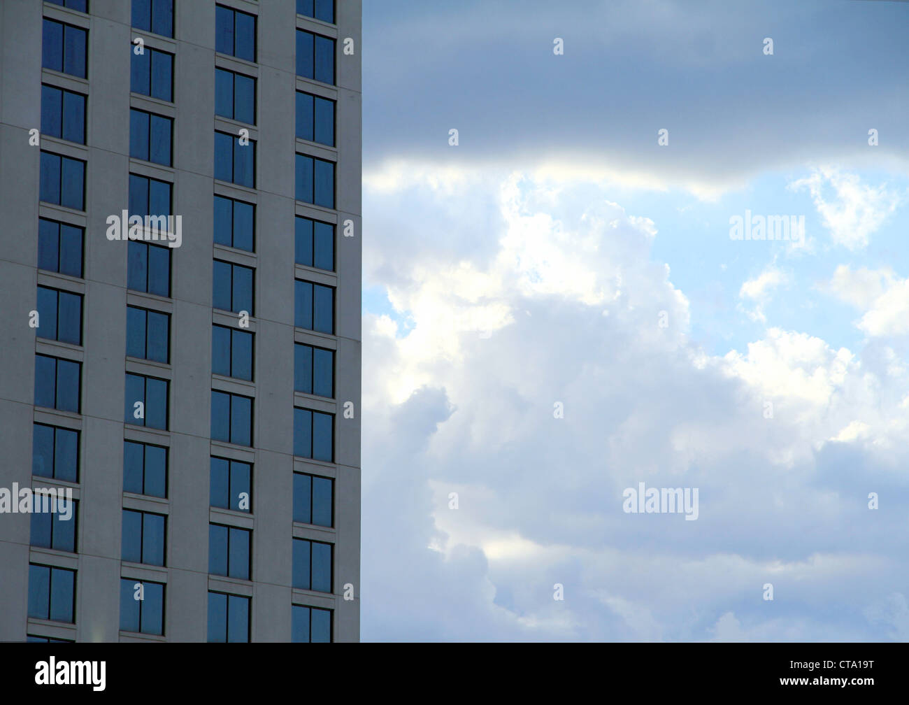 A modern office building and a cloudy sky Stock Photo - Alamy