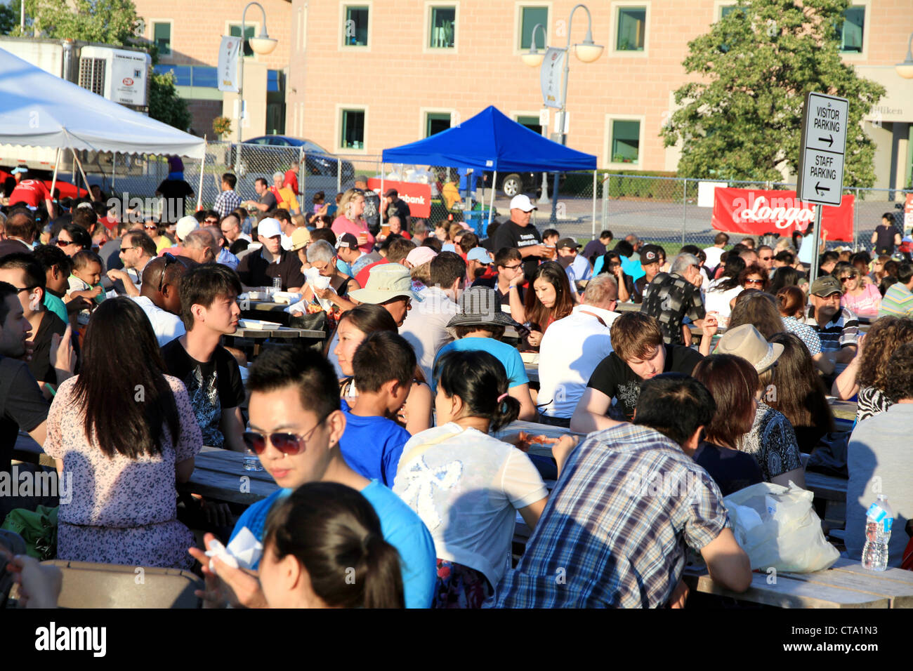 Crowd eating during the annual Rotary Club Ribfest in Markham, Ontario Stock Photo
