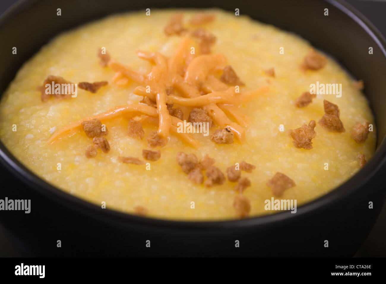 Vegan Grits with Soy Cheese and Textured Vegetable Protein Stock Photo