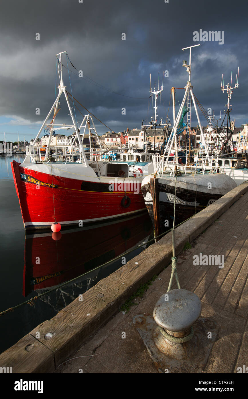 Town of Stornoway, Lewis. Picturesque evening view of the fishing fleet alongside Stornoway Harbour. Stock Photo