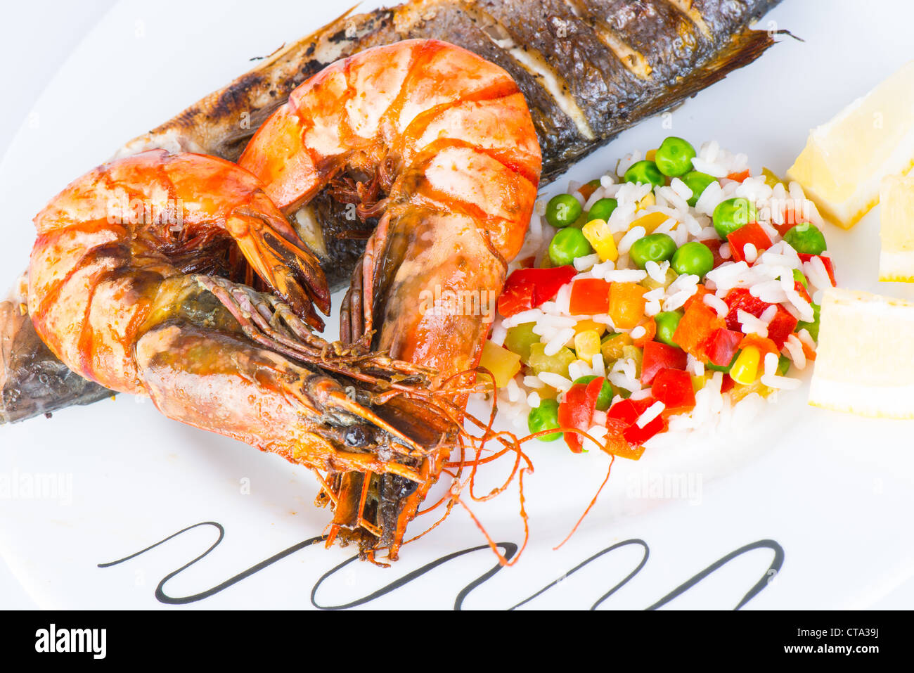 Giant prawns with sea bass fish Stock Photo - Alamy