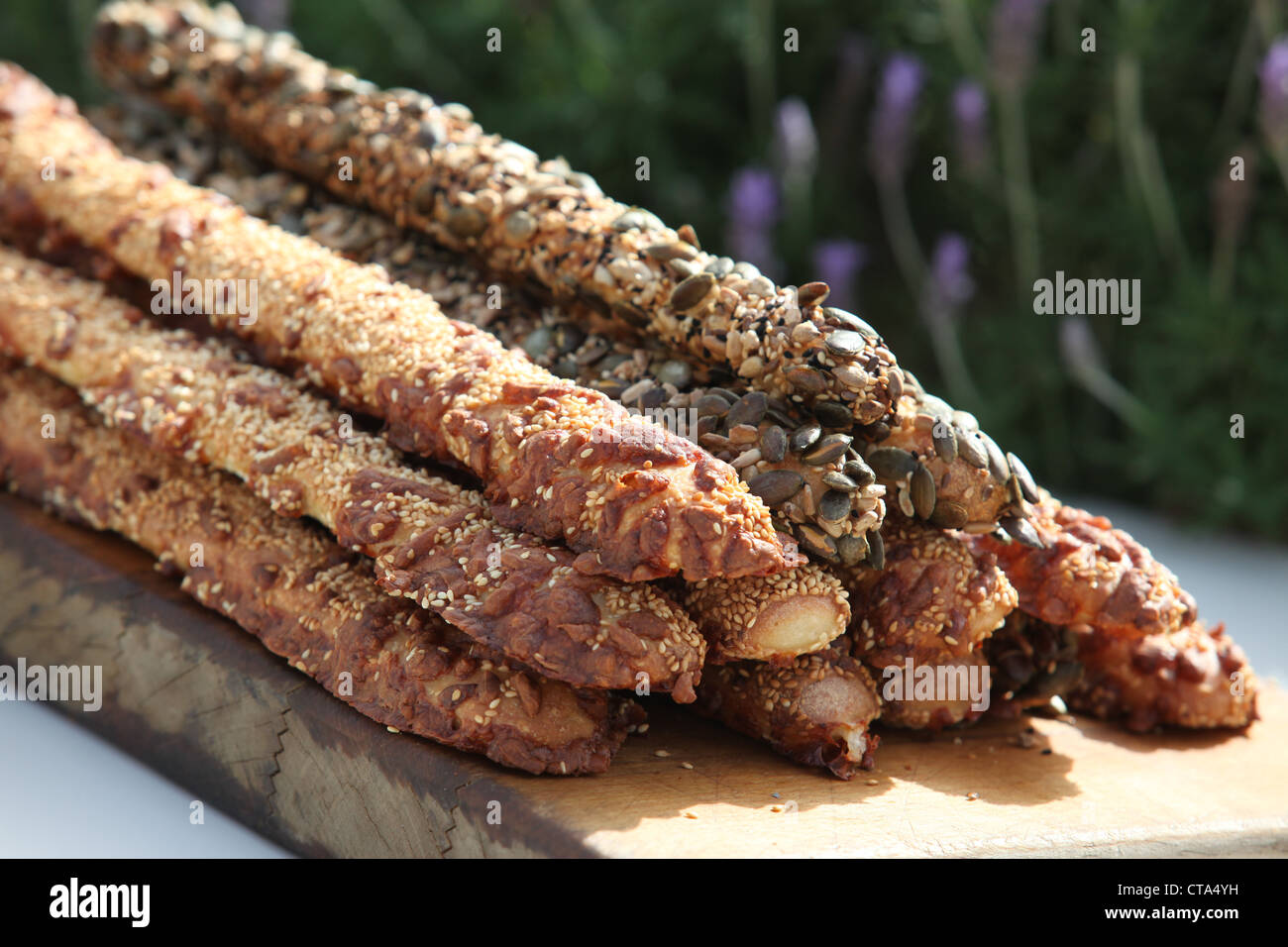 Breadsticks (grissini) selection of breadsticks topped with poppy seeds, sesame and herbs Stock Photo