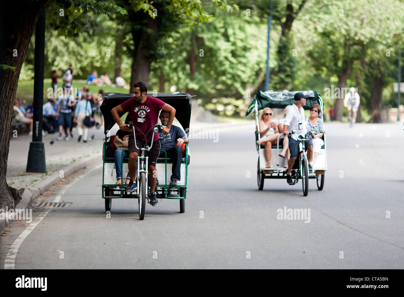 Tourists are transported through Central Park New York City on a cycle Rickshaw Stock Photo Alamy