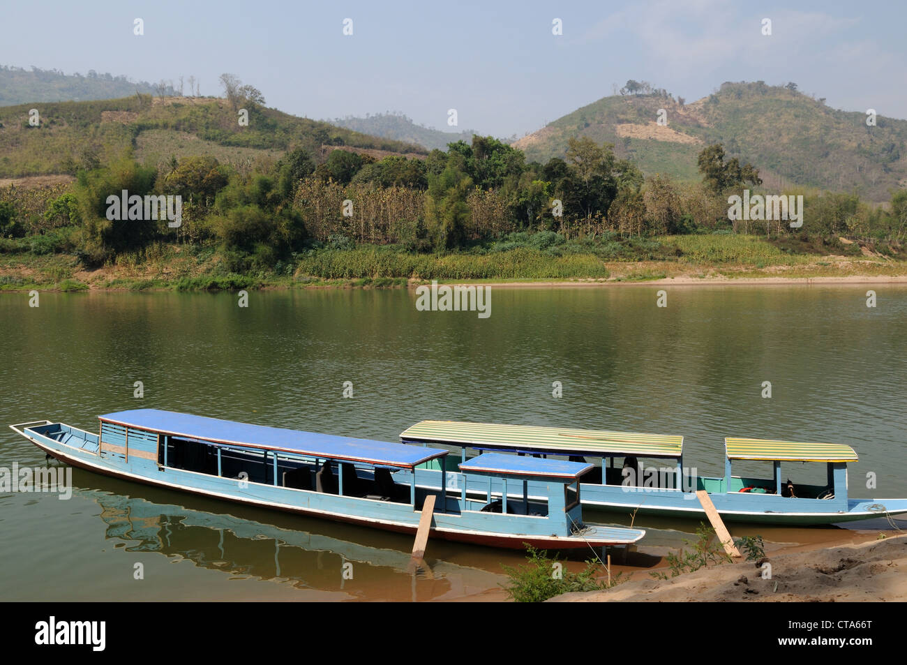 Lao tourist longboats boats boat on the Nam Ou River Laos Stock Photo