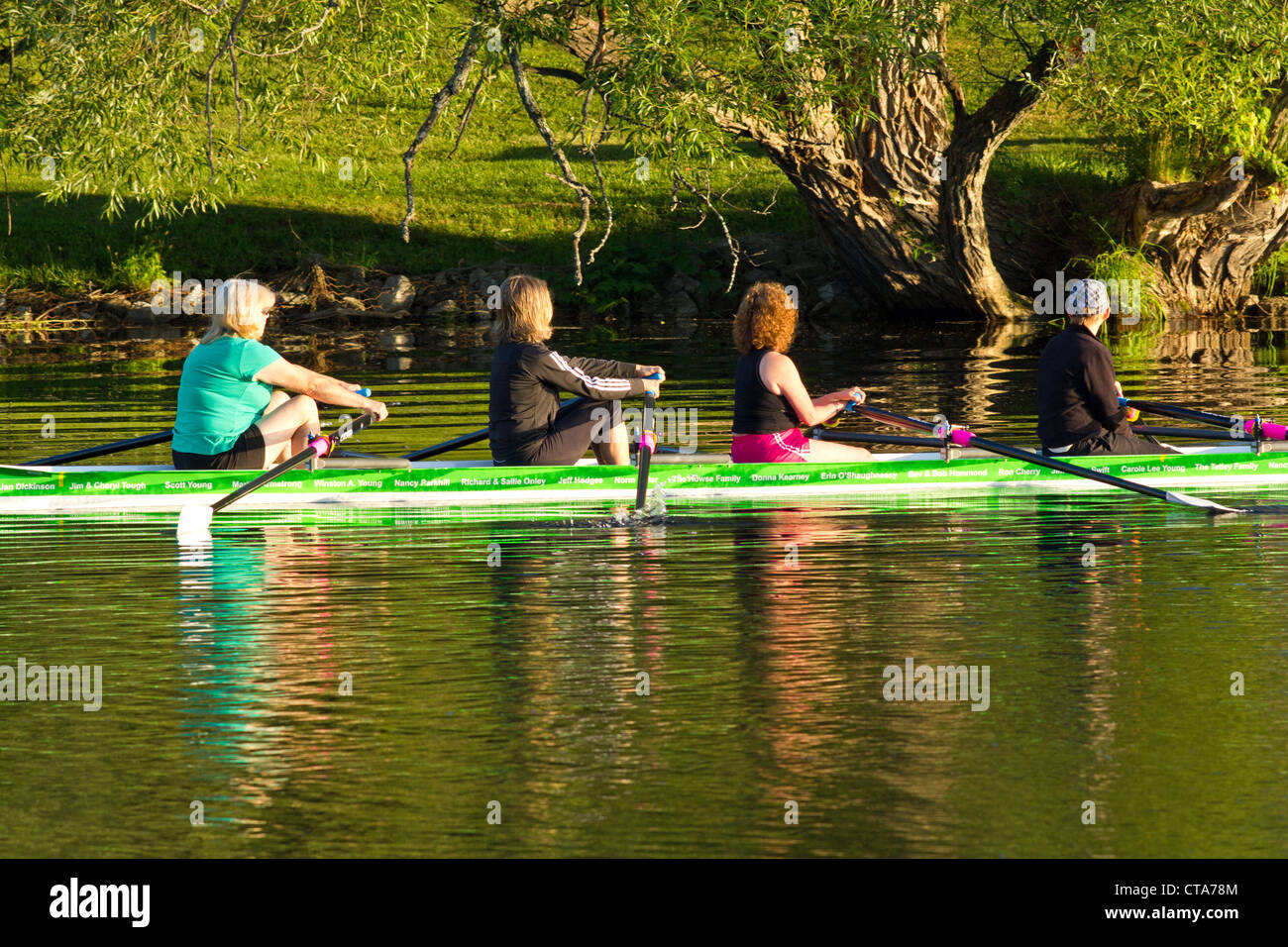 Rowing a boat in early morning Stock Photo - Alamy