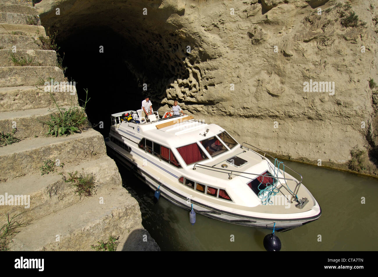 Boat coming out of the tunnel, Tunnel de Malpas, Canal du Midi, Midi, France Stock Photo