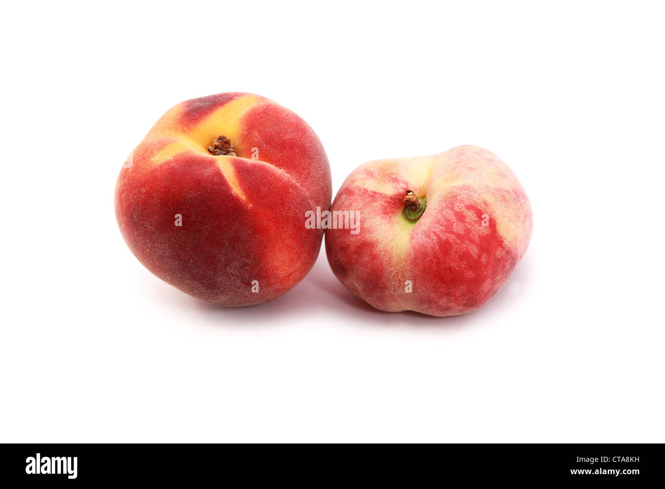 comparison of wild and cultivated perziks on white Stock Photo