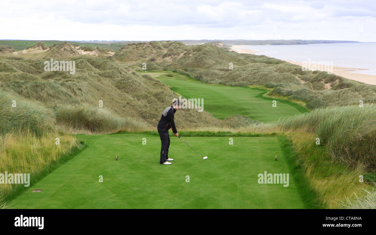 Golfers on the new Trump International Golf Links course in