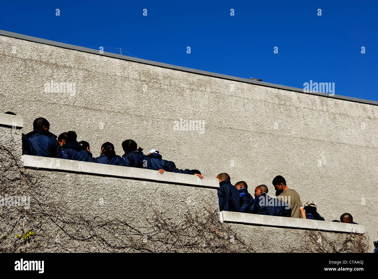 South African pupils waiting in line for cable car to go-up to Table Mountain, Cape Town, Western Cape Province, South Africa Stock Photo