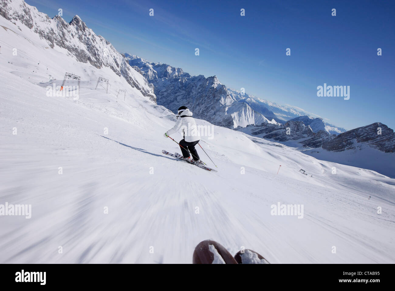 Skier descending down Weisses Tal, View over the plateau, Zugspitze, Upper Bavaria, Bavaria, Germany Stock Photo