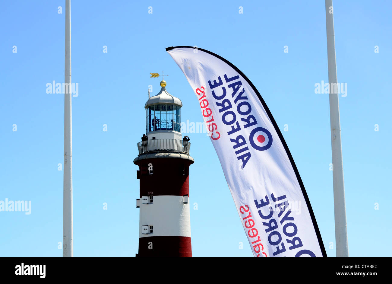 Air force banner with Smeatons tower lighthouse in background Plymouth UK Stock Photo