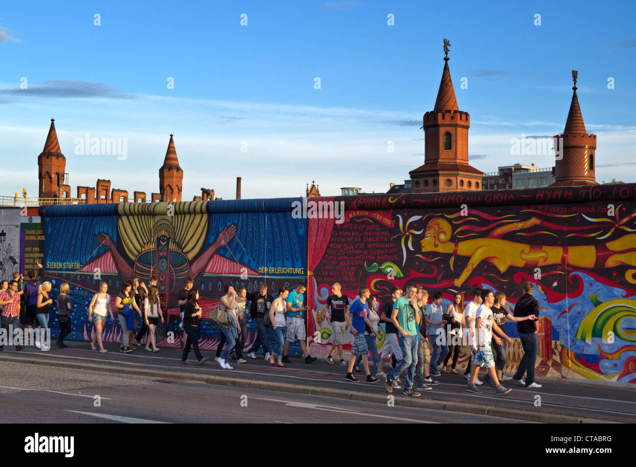 People in front of Berlin Wall mural, East Side Gallery, Berlin, Germany, Europe Stock Photo