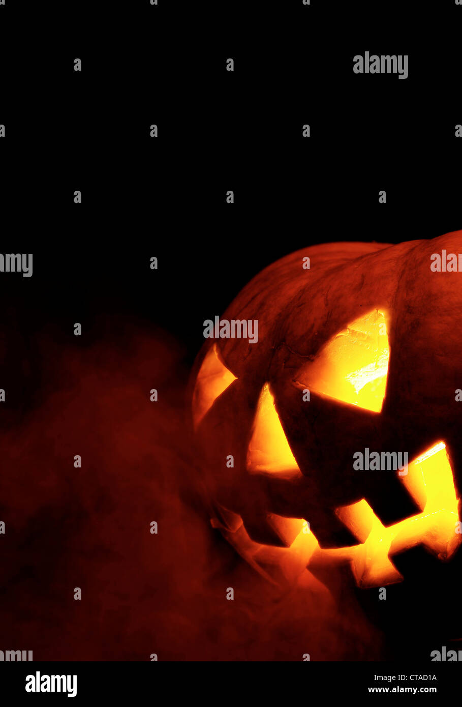 A scary old jack-o-lantern on black Stock Photo - Alamy