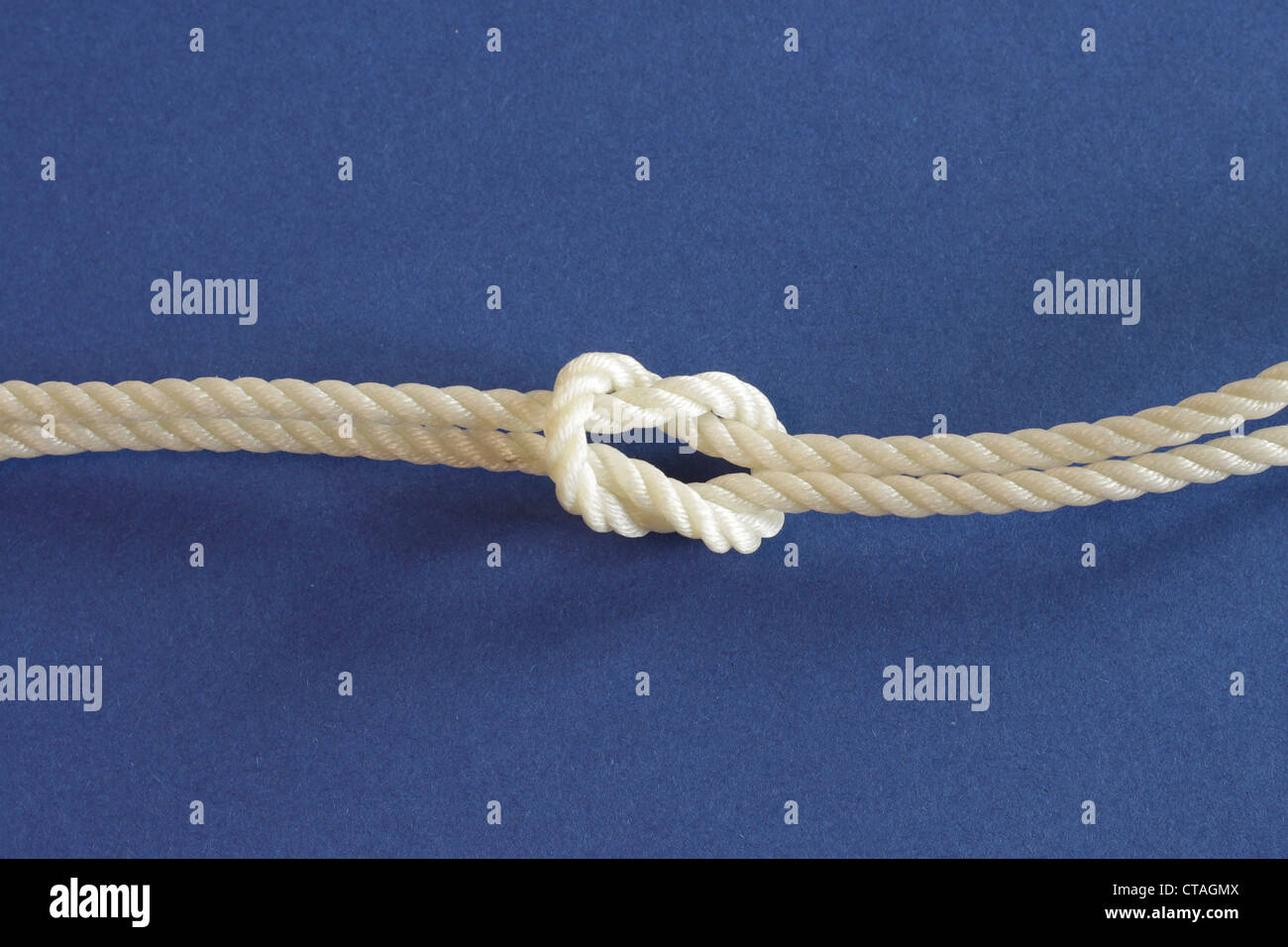 Crown knot on a blue background Stock Photo - Alamy