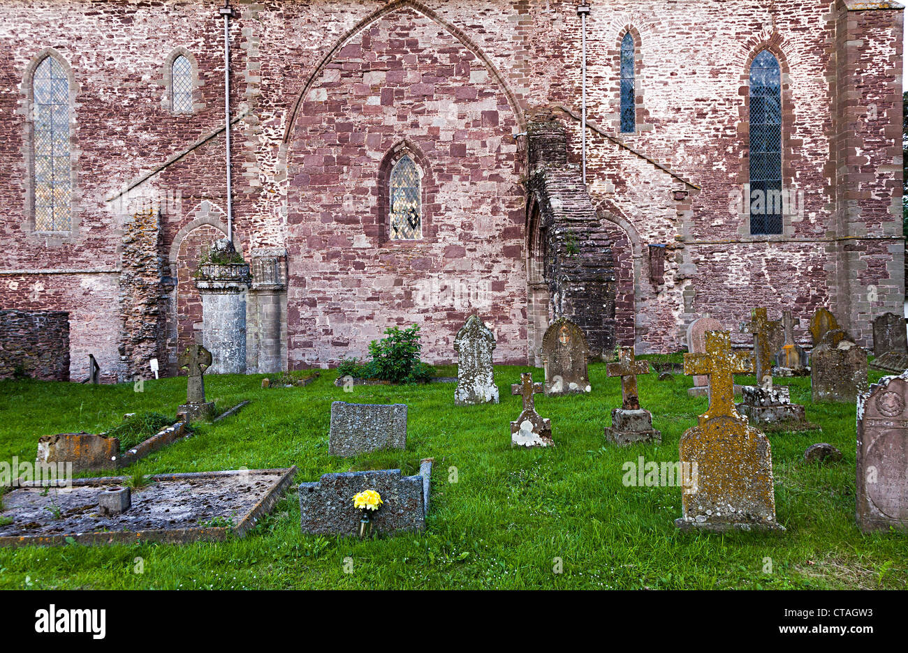 Western ruined exterior wall and graveyard, Abbey Dore, Herefordshire, England, UK Stock Photo