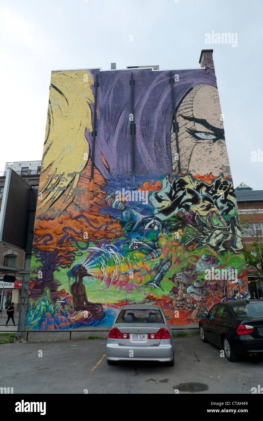 Wall mural of comic book character covering building St. Catherine street Montreal Quebec Canada Stock Photo