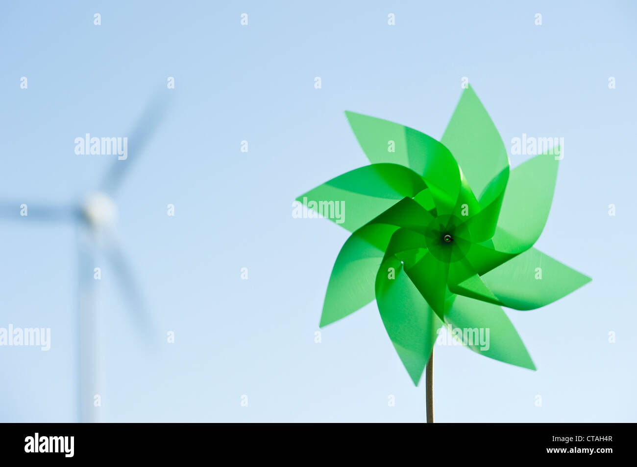 Toy windmill and large wind turbine, Black Forest, Baden-Wurttemberg, Germany Stock Photo